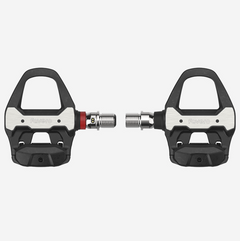 Close-up of the Favero Assioma PRO RS-1 single-sided road power meter pedal, highlighting its robust body and ANT+/Bluetooth…
