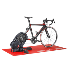 Approved Cycling Elite Training Mat protecting a wooden floor under a bike trainer, angled view.
