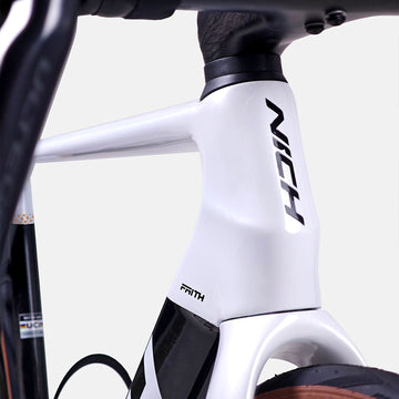 Approved Cycling Nich Faith Road Bike, close-up of front wheel, tire, and thru-axle system
