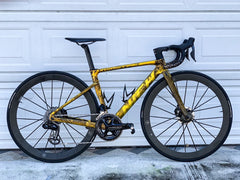 Close-up of front fork on Nich Legend, detailing its aerodynamic shape and carbon construction for precise steering.