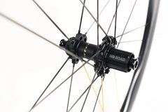Approved Cycling ATEM SilkRoad 3.8 wheelset, angled to highlight the aerodynamic wave rim design for superior control.