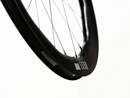 Princeton CarbonWorks Dual 5550 Evolution road bike wheels, highlighting carbon spoke technology.
