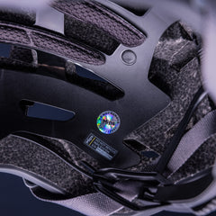 Close-up of PMT Elegant MIPS helmet branding. Subtle vendor badging on matte finish.