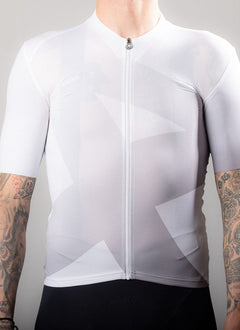 APPROVED CYCLING Fundamental Ltd. women's cycling jersey in white, side view on a rider in an aero dynamic position for an a…