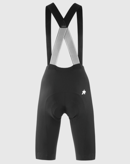 Assos DYORA R Bib Shorts S11 on female rider, demonstrating an aggressive riding position and ultralight comfort.
