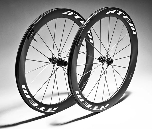 ATEM5 55 mm carbon wheelset pair photographed at an angle with white decals