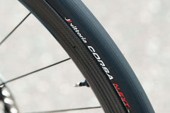 Side profile of Vittoria Corsa N.EXT TLR G2.0 0 Tlr road tire by APPROVED CYCLING - tread pattern optimized for wet & dry gr…