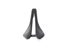 Berk Lupina Bike Saddle, carbon fiber weave texture, close-up of material, premium quality. APPROVED CYCLING.